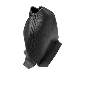 May include: A black leather shift boot, likely for a vehicle's gear stick. The boot is made of textured leather and features visible stitching along the seams. The design includes a flared base and a gathered top.