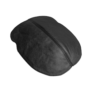 May include: A black leather flat cap with a textured surface. The cap has a rounded shape and a stitched seam running across the top. The hat is a classic style.
