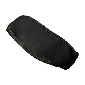 May include: A black motorcycle seat cover featuring a textured faux leather surface and prominent yellow stitching along the seams. The cover has an elongated, contoured shape designed to fit the profile of a standard motorcycle seat.