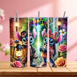 May include: A set of three stainless steel tumblers with a colorful design featuring the characters Stitch and Angel. The tumblers have a straw and are decorated with roses, lanterns, and the text "Bozzetto Barnetta".