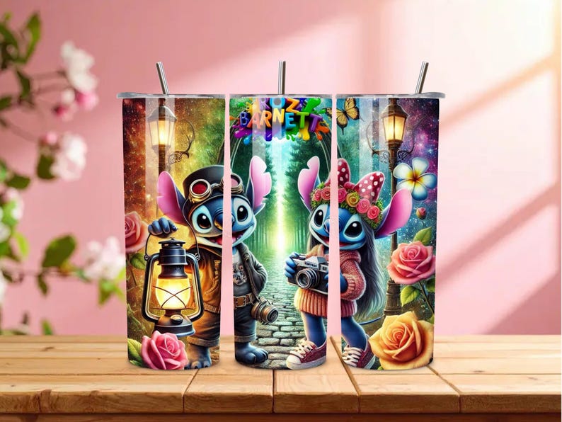 May include: A set of three stainless steel tumblers with a colorful design featuring the characters Stitch and Angel. The tumblers have a straw and are decorated with roses, lanterns, and the text "Bozzetto Barnetta".