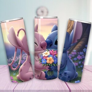 May include: Three stainless steel tumblers featuring cartoon characters Angel and Stitch. The tumblers depict the characters in a romantic setting with flowers and a sunset background. The tumblers are decorated with vibrant colors and are suitable for cold beverages.