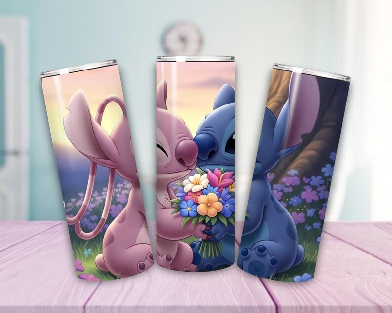 May include: Three stainless steel tumblers featuring cartoon characters Angel and Stitch. The tumblers depict the characters in a romantic setting with flowers and a sunset background. The tumblers are decorated with vibrant colors and are suitable for cold beverages.