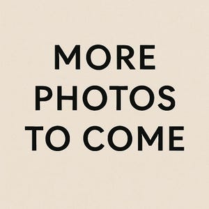 May include: Text on a beige background reads "MORE PHOTOS TO COME" in a bold, black font. The text is centered and stacked vertically, indicating additional product images will be available.