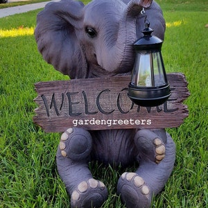 Solar Elephant with Welcome Sign Statue