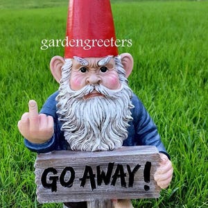 May include: A red-hatted garden gnome with a white beard gives the middle finger and holds a wooden sign that says "GO AWAY!"  A squirrel is peeking out from behind the sign.