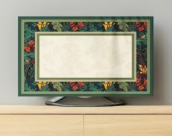 May include: A decorative TV screen cover featuring a floral design in shades of green, red, and yellow. The cover has a rectangular shape with a cream-colored center and a dark green border. The floral pattern includes leaves and flowers.