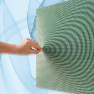 May include: A close-up of a textured, sage green fabric being stretched. The fabric has a ribbed pattern and appears to be flexible. The background features a soft, abstract design with blue and white elements.