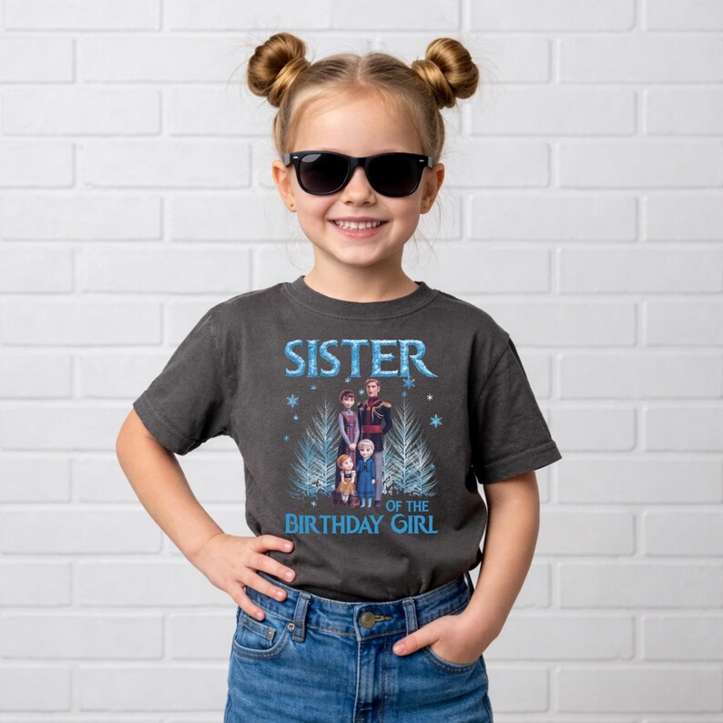 May include: A dark grey t-shirt with the text "SISTER OF THE BIRTHDAY GIRL" in blue. The shirt features a graphic of characters from a popular animated movie. The girl in the image is wearing sunglasses and blue jeans.