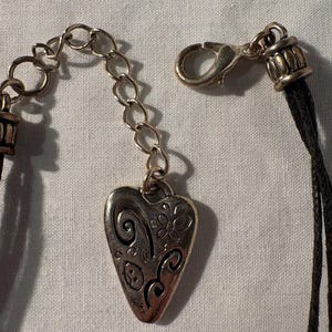 May include: A handmade wooden sign with the text "Welcome" in a playful font. The sign features a distressed white background and a dark brown frame, ideal for a front door or entryway. The sign measures approximately 30 cm wide.