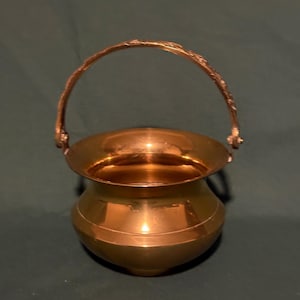Vintage small brass pot with decorative handle