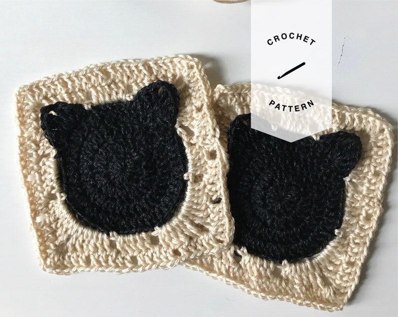May include: Two crocheted squares with black cat faces. The squares are beige with a black circle for the face and two black triangles for ears. The text "CROCHET PATTERN" is written in white on a black background.