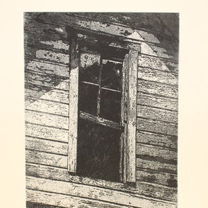 May include: A black and white print of a weathered wooden building with a single window. The window is open and the wood is worn and cracked. The print is titled "Weathered" and signed by the artist.