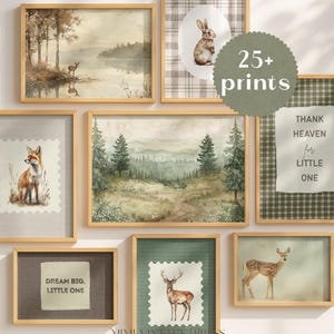 May include: A collection of framed art prints featuring watercolor illustrations of woodland animals and landscapes. The prints include a deer by a lake, a fox, a rabbit, a deer, and forest scenes. Some prints have text that reads "Dream Big, Little One" and "Thank Heaven for Little One."
