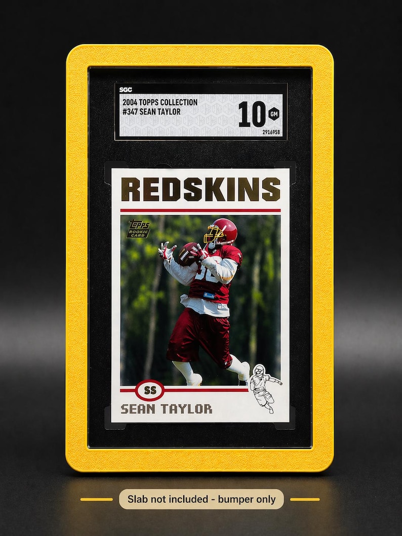 May include: A framed 2004 Topps Collection football card featuring Sean Taylor in a Redskins uniform. The card is graded 10 by SGC. The frame is yellow and the card is in a black holder. The text "REDSKINS" is prominently displayed.