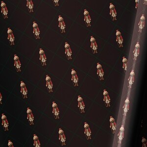 May include: Dark brown wrapping paper with a repeating pattern of small, vintage-style dolls in red coats and hats. The paper is partially rolled, showing the pattern and texture.