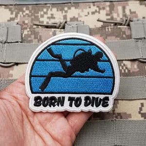 May include: A rustic wooden sign with the text "Welcome to our home" in white lettering. The sign features a distressed finish and a simple, inviting design, perfect for front door decor.