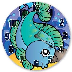 Miniature table clock to please rodeo lover or ranch person watchface. featuring a charm of a horse within a spur on a silver e.g.o