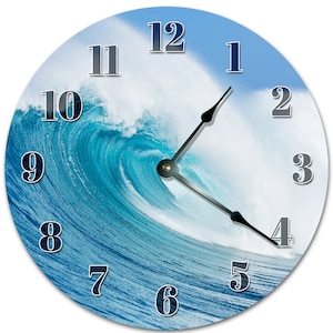 May include: Round wall clock featuring a vibrant image of a crashing ocean wave in shades of blue and white. The clock face displays black hands and silver numerals against the wave design. A decorative piece for a coastal or beach-themed decor.