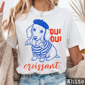 Oui Oui Croissant - Maglietta unisex con simpatico cane francese, simpatica maglietta parigina, regalo per gli amanti dei viaggi con bassotto, maglietta per la colazione parigina, cibo