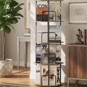 May include: A modern, multi-tiered magazine rack with a black metal frame and light wood shelves. The rack holds various magazines with visible titles like "ICON" and "CONTEMPORARY". The design is sleek and functional, suitable for home or office.