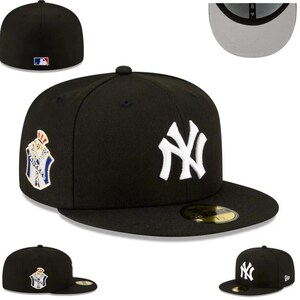 May include: A black baseball cap featuring the New York Yankees logo in white on the front. The cap has a flat brim and a small MLB logo on the back. A patch is on the side. The cap is a fitted style.