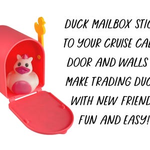 May include: A pink mailbox with a yellow duck-shaped flag, open to reveal a white and pink rubber duck. Text on the image reads: "DUCK MAILBOX STICKS TO YOUR CRUISE CABIN DOOR AND WALLS TO MAKE TRADING DUCKS WITH NEW FRIENDS FUN AND EASY!"