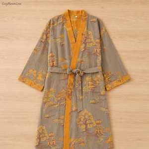 May include: A grey robe with a yellow trim and a matching tie. The robe features a repeating pattern of yellow trees and buildings. The robe is made of a soft, lightweight material.