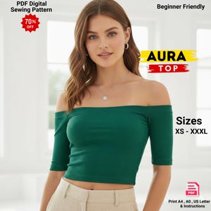 Può includere: Un top verde con spalle scoperte e maniche corte. Il top a coste presenta il testo "AURA TOP". L'immagine include anche il testo "Taglie XS - XXXL" e "PDF Digital Sewing Pattern".