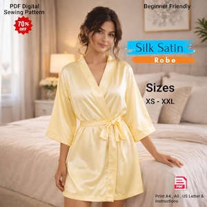 May include: A pale yellow silk satin robe with a matching tie belt. The robe has wide sleeves and a V-neck design. Text on the image reads "Silk Satin Robe" and "Sizes XS-XXL". The image also includes text that says "PDF Digital Sewing Pattern" and "Beginner Friendly".