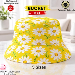 Puede incluir: Un sombrero de pescador amarillo con un patrón repetitivo de margaritas blancas con centros amarillos. La imagen incluye el texto: PDF Digital Sewing Pattern, 70% OFF, BUCKET Hat, Trusted by Customers, Beginner Friendly, 5 Sizes, Print A4, A0, US Letter & Instructions.