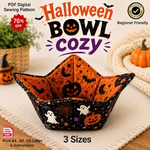 Peut inclure: Un bol en tissu matelassé sur le thème d'Halloween aux couleurs orange et noir. L'intérieur présente des chauves-souris, des étoiles et des citrouilles, tandis que l'extérieur montre des fantômes, des toiles d'araignée et des citrouilles.