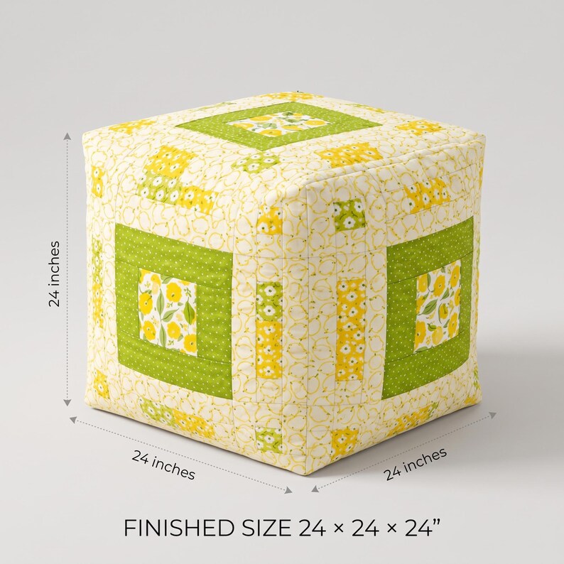 May include: A square fabric ottoman featuring a patchwork design with yellow floral patterns and solid lime green borders. The cube-shaped piece has a finished size of 24 inches by 24 inches by 24 inches as indicated by the text and dimension lines.