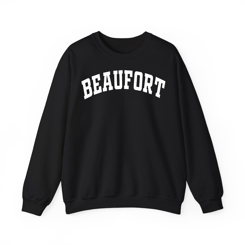 May include: Black crew neck sweatshirt with the word "BEAUFORT" printed in white, arched lettering. The sweatshirt is a solid black color and has long sleeves. The text is centered on the chest.