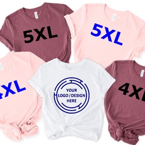 May include: A collection of short-sleeved t-shirts in various colors, including pink, white, and maroon. Some shirts display the size "4XL" or "5XL" in bold text. One white shirt features a circular design with the text "YOUR LOGO / DESIGN HERE".