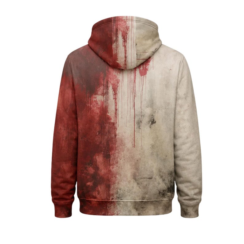 Pode incluir: Uma camisola com capuz e mangas compridas com um design de dois tons. O lado esquerdo apresenta um efeito de tinta vermelha salpicada, enquanto o lado direito &eacute; de um bege esbranqui&ccedil;ado com manchas escuras e padr&otilde;es de gotas verticais.