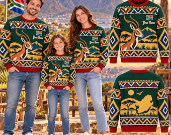 May include: A green long-sleeve jumper featuring a South African flag, a springbok, and a landscape print. The design includes geometric patterns in red, yellow, and blue, with the text Your Name printed on the chest area.