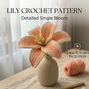 May include: A crochet lily flower with peach and cream petals in a beige vase. Text reads: LILY CROCHET PATTERN, Detailed Single Bloom, VIDEO TUTORIAL INCLUDED!. A ball of peach yarn and a wooden crochet hook are visible near the vase.