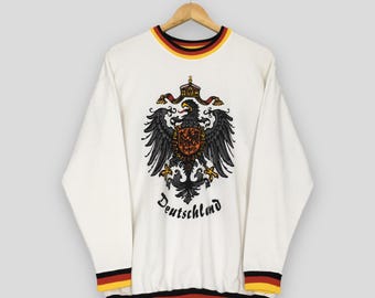 Sudadera blanca vintage de Alemania, talla grande. Sudadera con cuello redondo y logo estampado de Alemania. Sudadera con águila patriótica de Alemania, talla L.