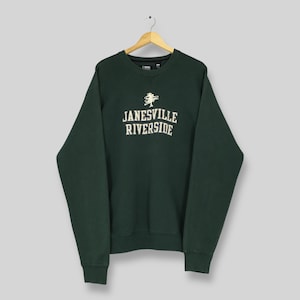 May include: A set of three ceramic mugs with a speckled, matte finish. The mugs are in shades of cream, light gray, and dark gray. Each mug has a simple, minimalist design, perfect for coffee or tea.