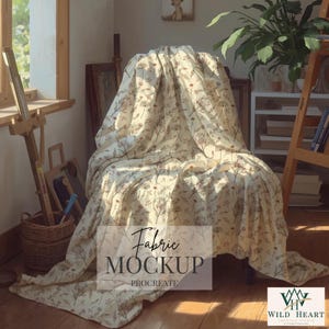 May include: A cream-colored fabric featuring a repeating botanical print of brown and muted green wildflowers and stems. The fabric is draped over a chair, with the text "Fabric MOCKUP PROCREATE" centered and a "WILD HEART" logo in the corner.