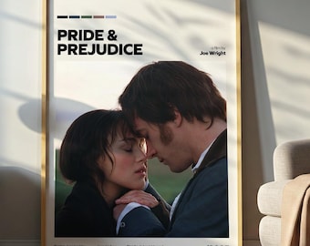 May include: A framed movie poster for "Pride & Prejudice" featuring a romantic image of two people. The poster has a gold frame and is displayed in a room with a lamp, side table, and a chair.