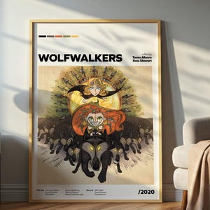 May include: A framed poster featuring the title "WOLFWALKERS" with illustrations of characters from the animated film. The artwork includes a central figure with red hair and a wolf, set against a backdrop of a sunburst design. The poster is in a wooden frame.
