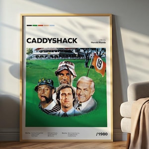 May include: A framed movie poster for Caddyshack featuring a green golf course background, a flag with the number 19, and portraits of four actors. The text includes the title Caddyshack, the director Harold Ramis, and the release year 1980.