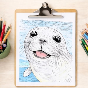 May include: A smiling seal illustration on a clipboard. The seal is white with black eyes and whiskers, and a pink tongue. The background features blue water. Colored pencils are in a green cup and scattered around the clipboard.