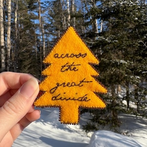 May include: A white ceramic mug with a black handle and the text "But First, Coffee" in a black, bold font. The mug is on a white surface. The mug is 4 inches tall.
