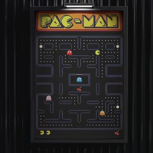 May include: Framed Pac-Man arcade game artwork. The black background features the classic maze with Pac-Man and ghosts. The title "PAC-MAN" is in yellow and orange. The artwork is in a black frame.