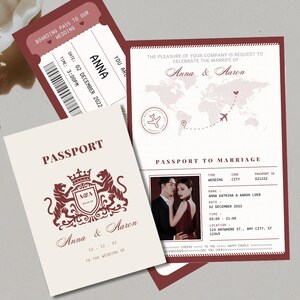 May include: A collection of wedding stationery, including a passport, boarding pass, and invitation. The passport is cream-colored with burgundy text and a crest. The invitation features a world map and a photo of a couple. The boarding pass is burgundy.