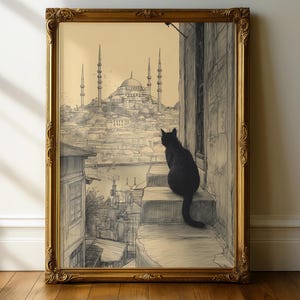 Puede incluir: Una impresión artística enmarcada que presenta un boceto a lápiz de un paisaje urbano con minaretes y un edificio con cúpula. Un gato negro está sentado en unos escalones, mirando la ciudad. El marco es ornamentado con un acabado dorado.