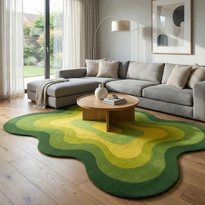 May include: A modern living room featuring a gray sectional sofa, a round wooden coffee table, and a unique, wavy rug. The rug showcases a gradient of green and yellow hues, adding a pop of color to the space. A floor lamp and artwork complete the decor.